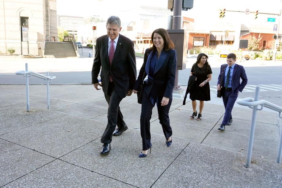 Sen. Manchin and Pam Murphy, COO of Infor, walk to the grand opening of Infor's Charleston office.